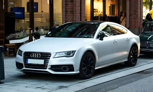White Audi Car Parked in the City