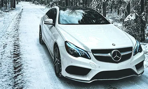 Mercedes Benz E220 White Car in Snowy Tract